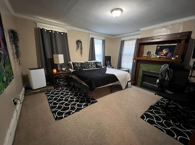 carpeted bedroom featuring crown molding and a fireplace