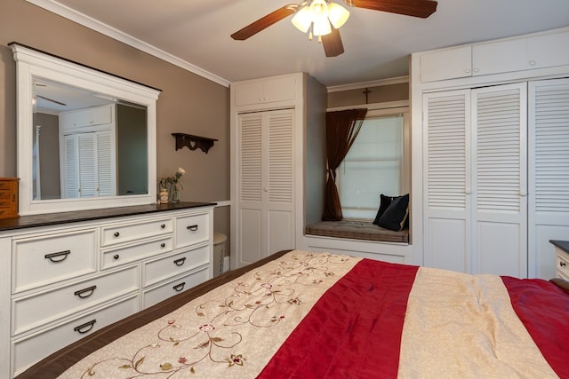 bedroom featuring multiple closets, ornamental molding, and ceiling fan