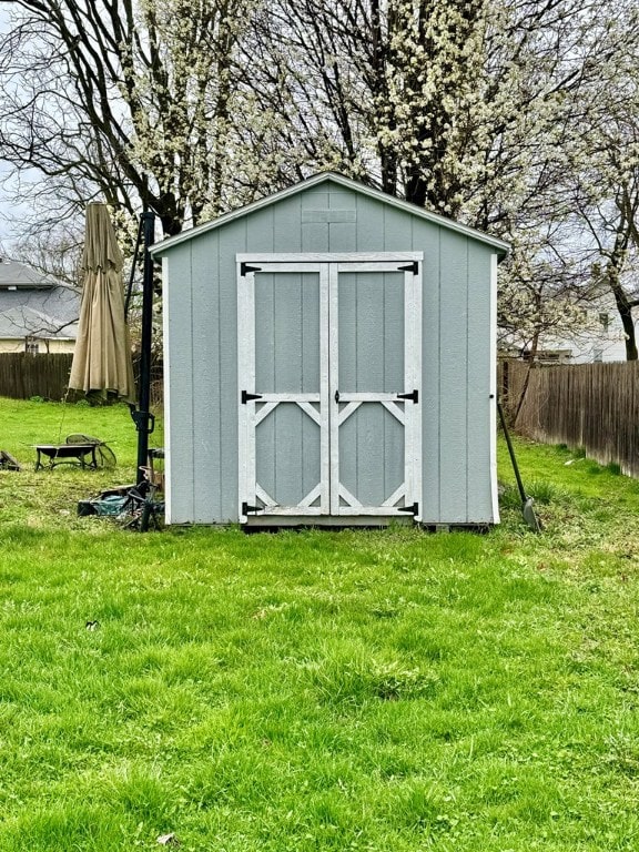 view of outbuilding with a lawn