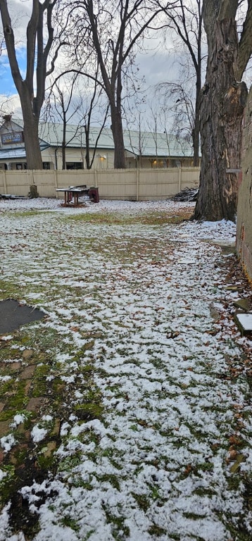 view of yard covered in snow