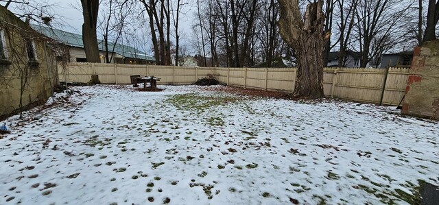 view of yard covered in snow