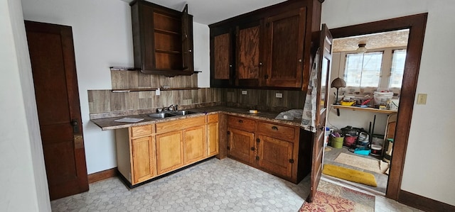 kitchen featuring tasteful backsplash and sink