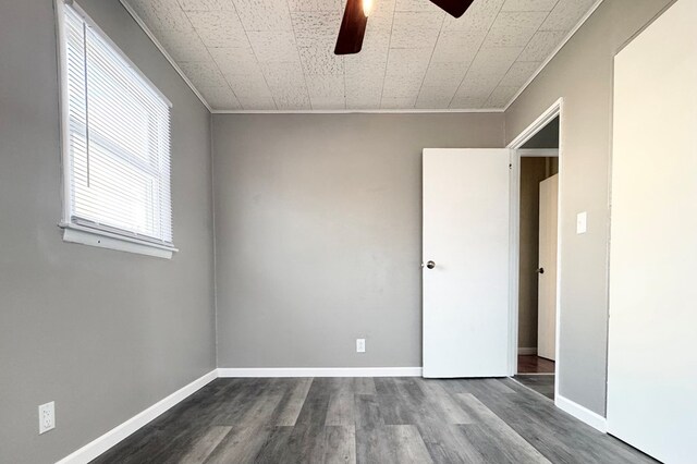 spare room featuring crown molding, ceiling fan, and hardwood / wood-style floors