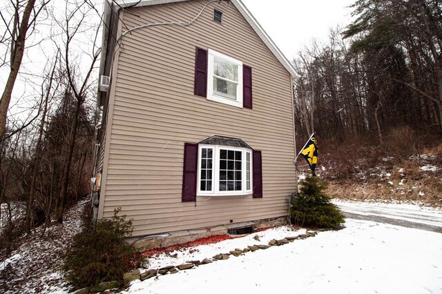 view of snow covered property