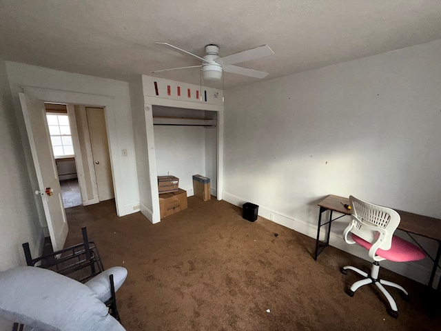 interior space with ceiling fan and a closet