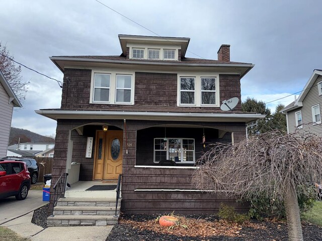 view of front of home featuring covered porch