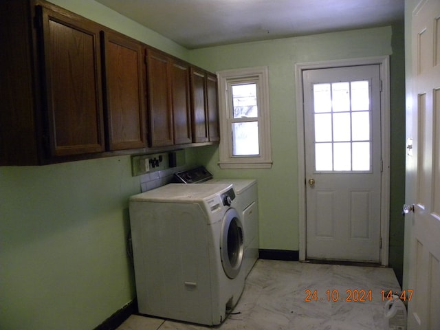 759 Main St, Chemung, NY 14825 - clothes washing area featuring cabinets and washer and clothes dryer