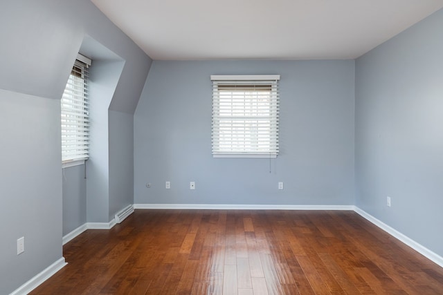 bonus room featuring dark wood-type flooring