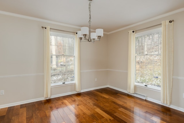 unfurnished dining area with hardwood / wood-style floors, ornamental molding, a chandelier, and a healthy amount of sunlight