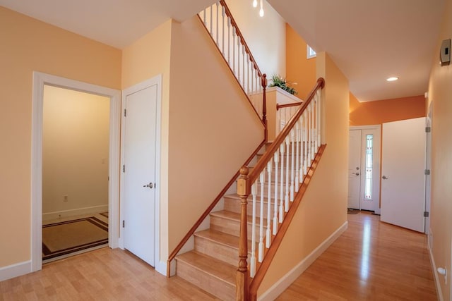 stairs with wood-type flooring