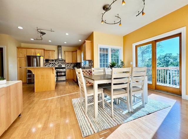 dining room with light wood-type flooring