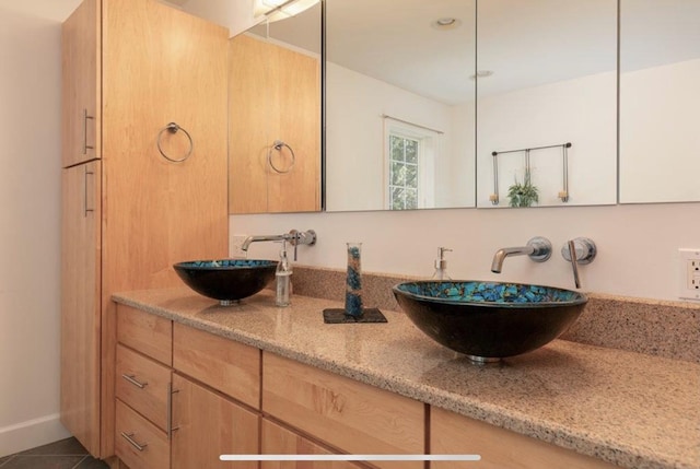 bathroom with vanity and tile patterned floors