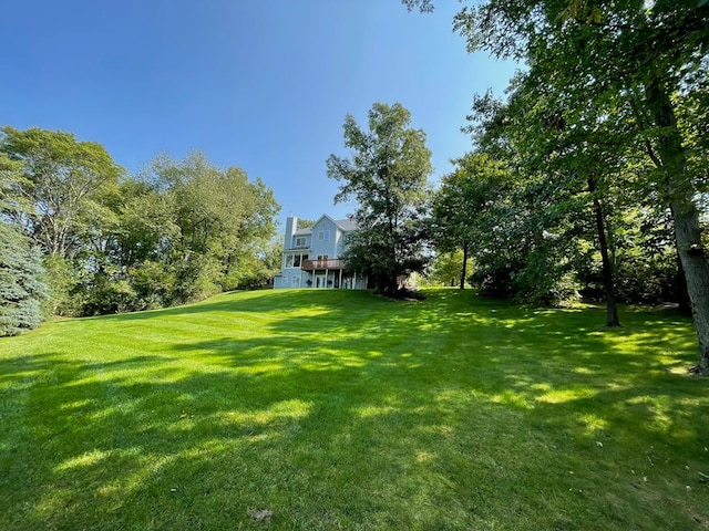 view of yard with a wooden deck