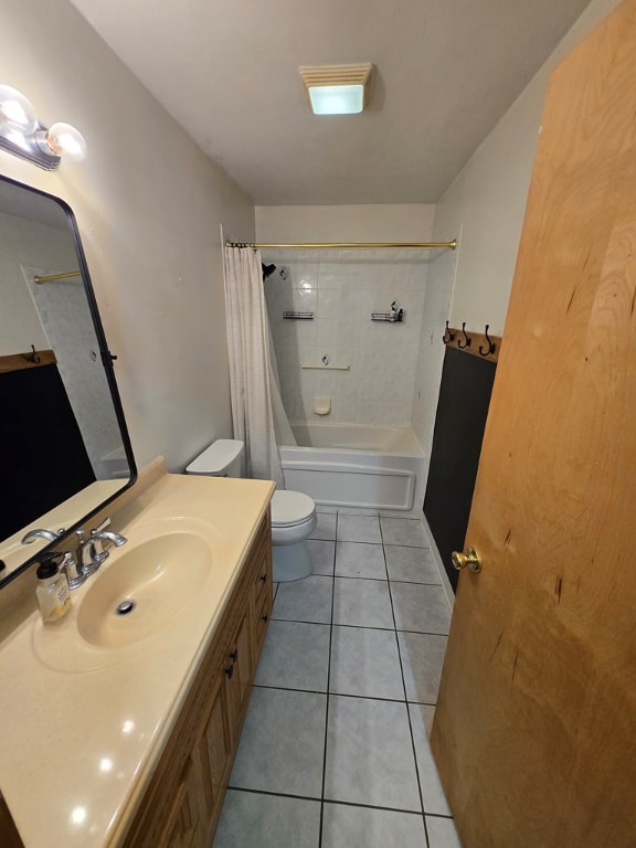 full bathroom featuring shower / tub combo with curtain, vanity, toilet, and tile patterned flooring