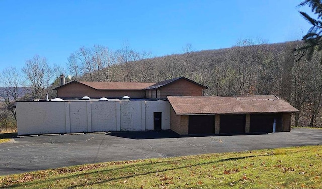 view of side of property with a garage