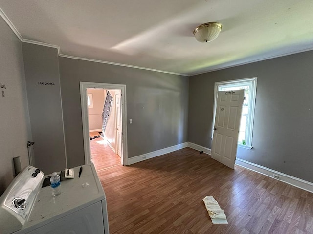 interior space with hardwood / wood-style floors and crown molding