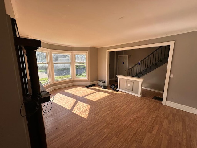 interior space with crown molding and hardwood / wood-style floors