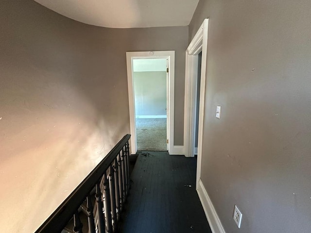 corridor featuring dark hardwood / wood-style floors