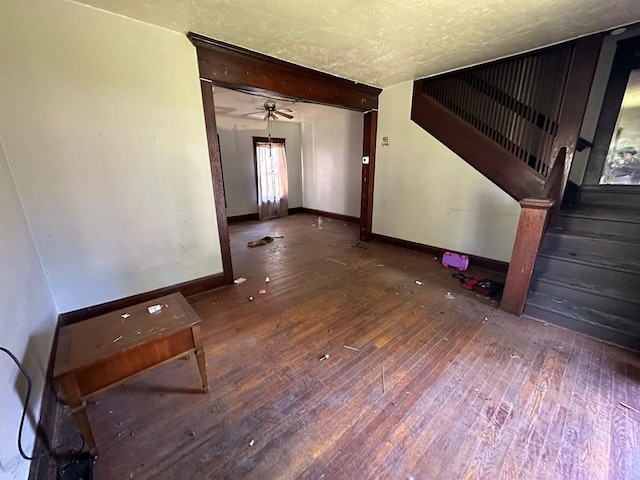 interior space featuring dark hardwood / wood-style flooring and a textured ceiling