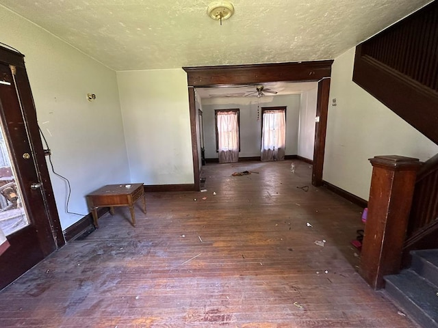 interior space featuring dark hardwood / wood-style floors and a textured ceiling