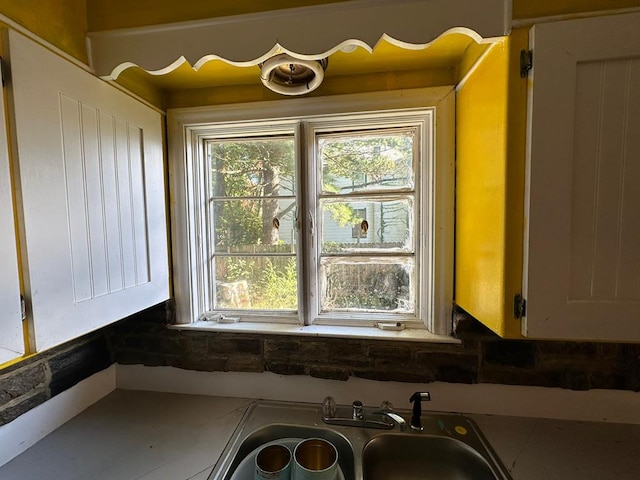 details featuring sink and white cabinets