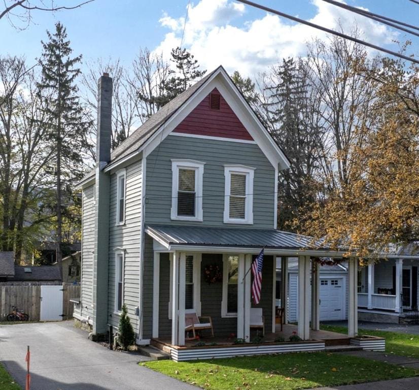 view of front of house with a garage and covered porch