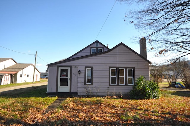 bungalow with a front lawn