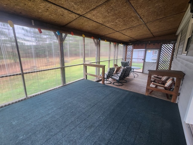 unfurnished sunroom with plenty of natural light