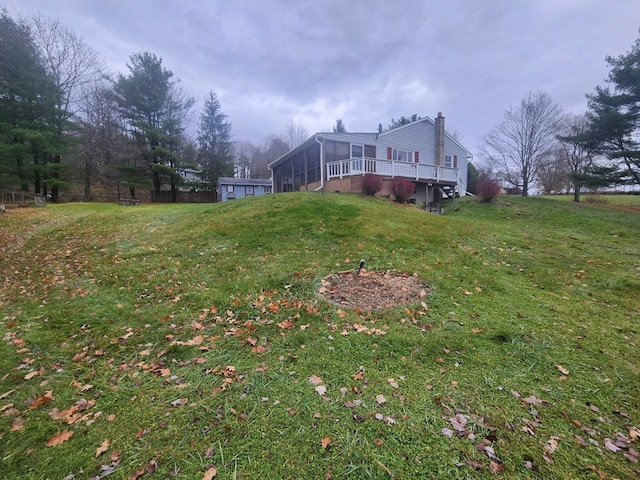 view of yard with a sunroom