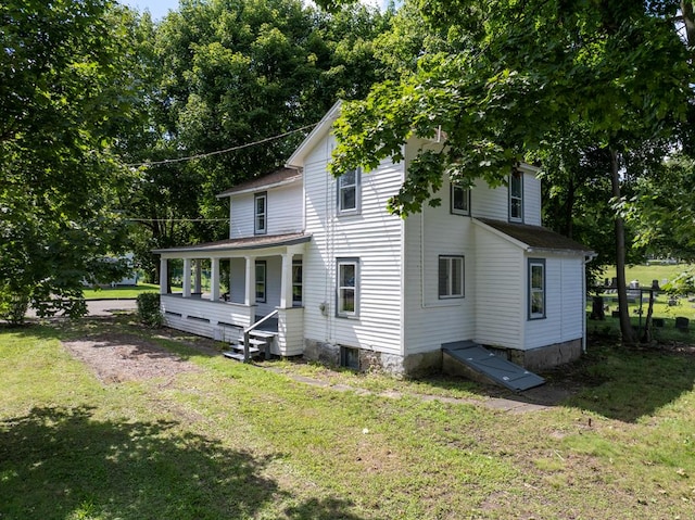 exterior space featuring a front yard and covered porch