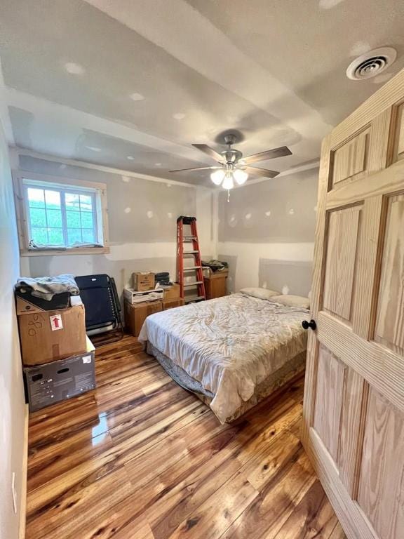 bedroom with hardwood / wood-style floors and ceiling fan