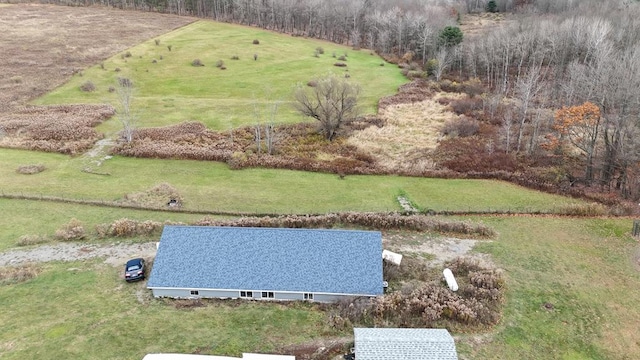 birds eye view of property with a rural view