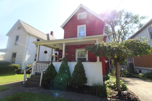 view of property with covered porch