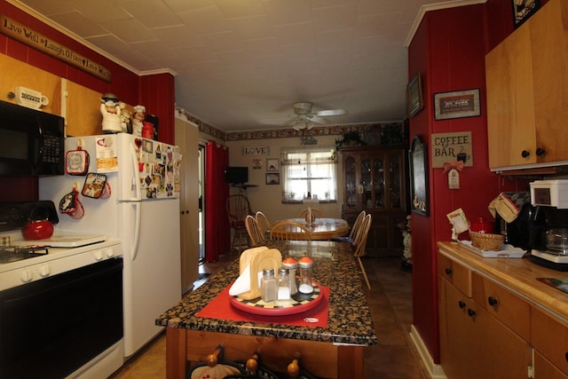 kitchen featuring ceiling fan and white range with gas cooktop