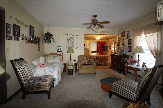 interior space with ornamental molding, carpet floors, and ceiling fan