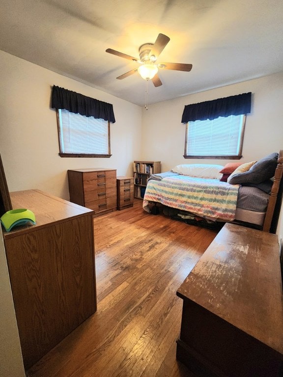 bedroom featuring ceiling fan and wood finished floors