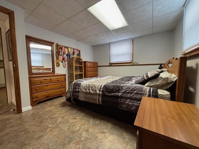 bedroom with a drop ceiling