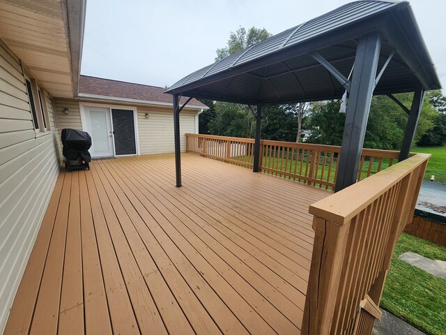 deck featuring a grill and a gazebo