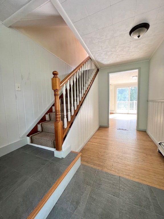 stairs featuring hardwood / wood-style flooring