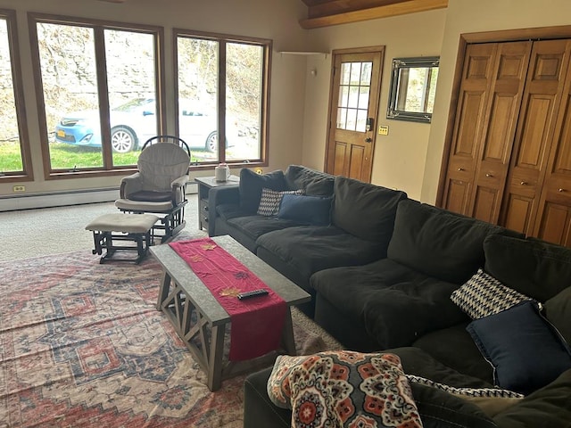 living room with carpet and a baseboard heating unit