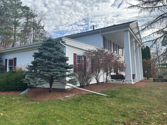 view of property exterior featuring a yard