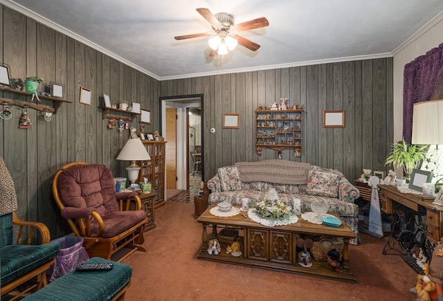 living room featuring crown molding, ceiling fan, and carpet