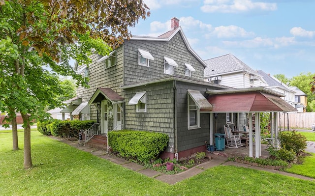 view of property exterior with a yard