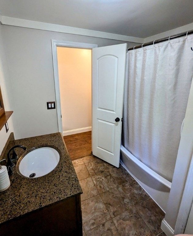 bathroom featuring vanity and shower / bath combination with curtain