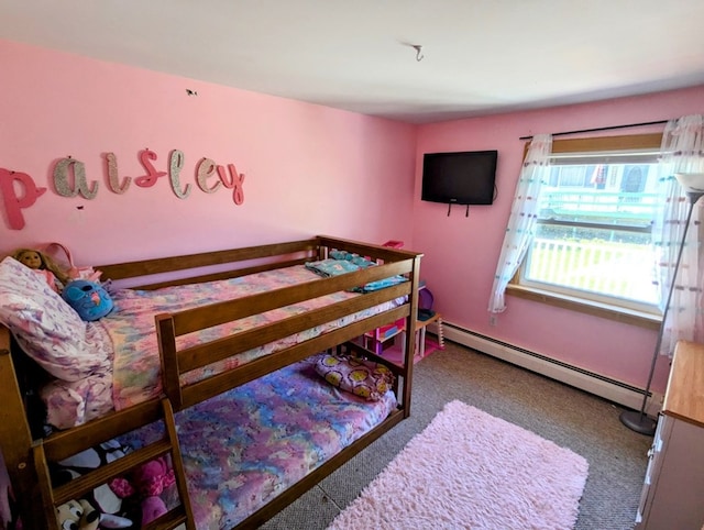 bedroom with a baseboard radiator and carpet