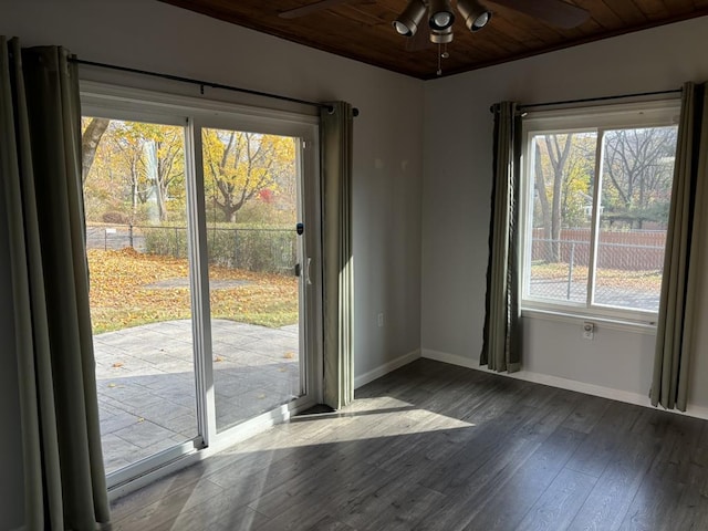 doorway to outside featuring ceiling fan, dark wood-type flooring, and wood ceiling