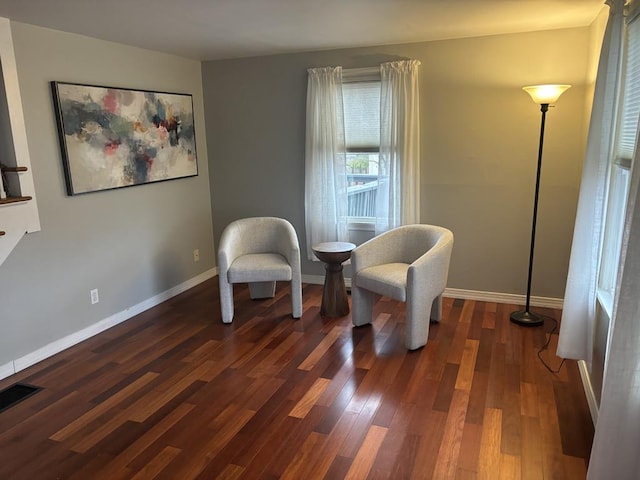 sitting room with dark hardwood / wood-style floors