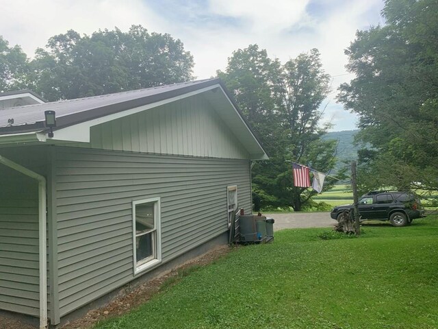 view of home's exterior with a yard