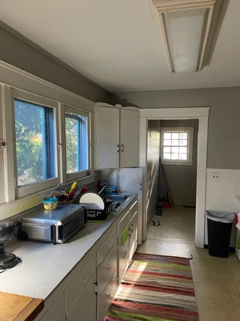 kitchen with sink and white cabinets