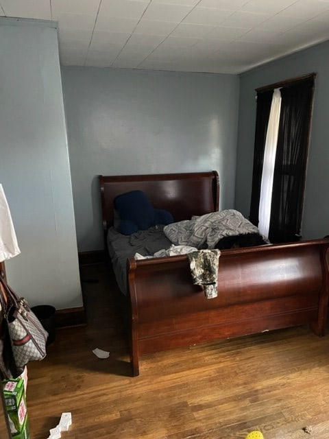 bedroom with hardwood / wood-style floors